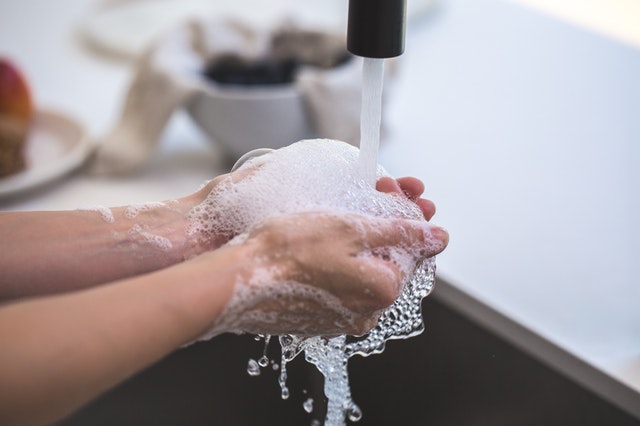 Person Washing Hands Person Washing Hands